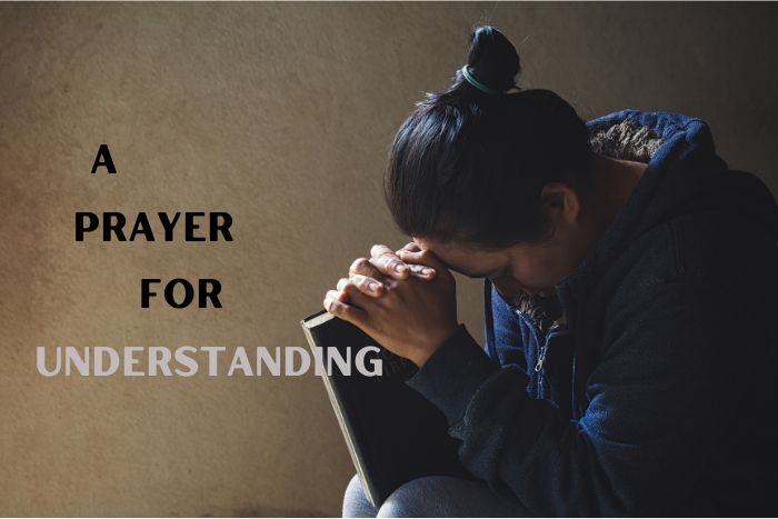 Woman praying with Bible